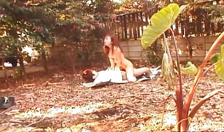 Asian babe is fucked in the garden on some papers
